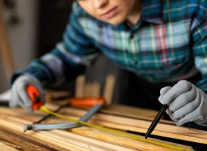 woman-measuring-wood-planks